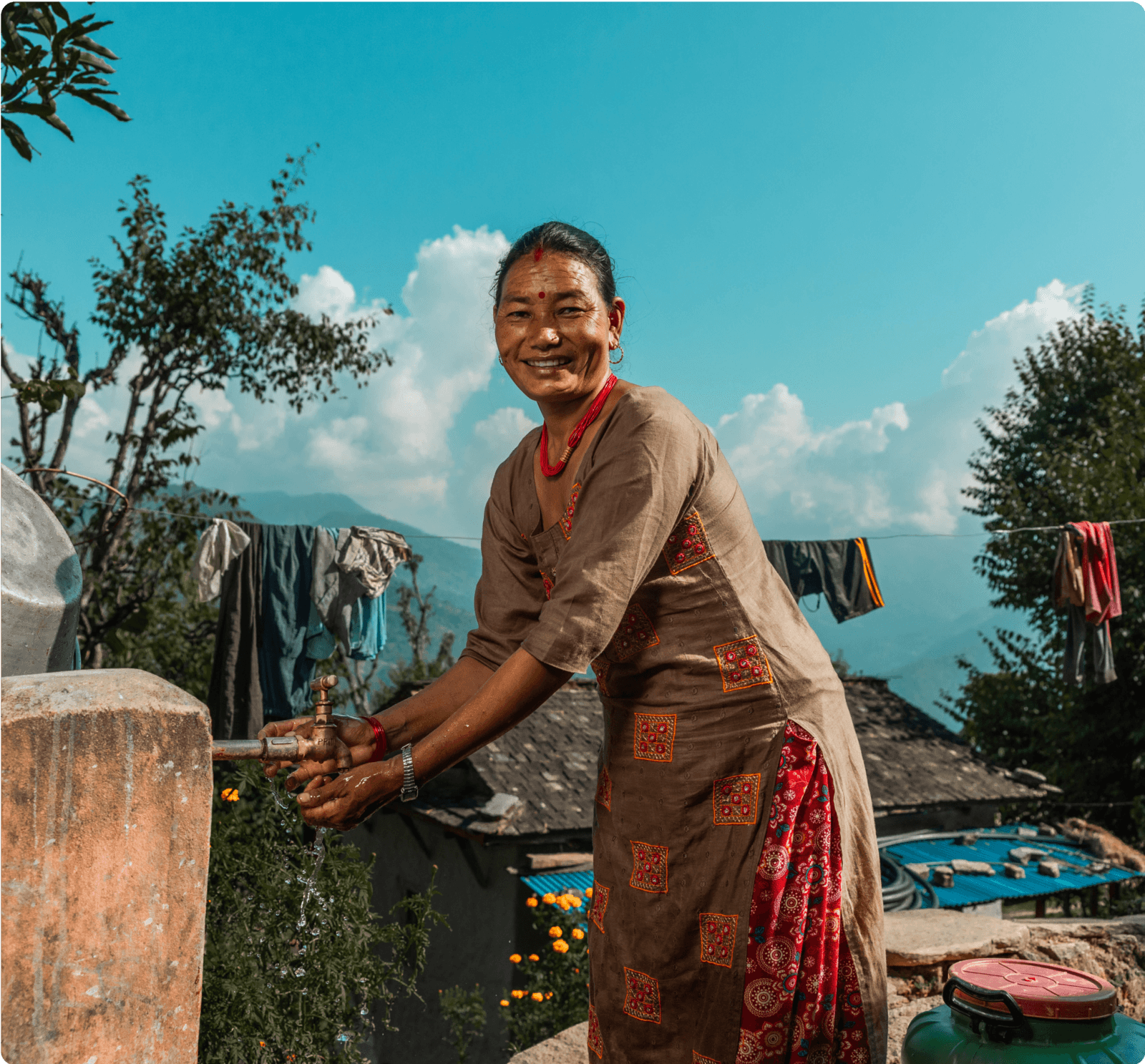 Woman collecting clean water outdoors